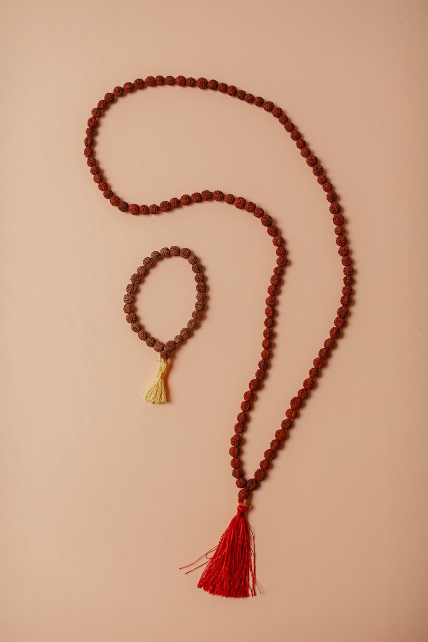 brown beaded necklace on beige background